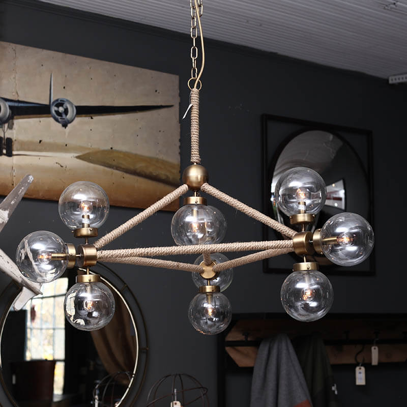 The Rope Globe Chandelier hangs like a work of fine art that works with many styles. We love the tightly woven rope chain across the structure of the chandelier. Its geometric structure and unusual glass ball lights will transform any living room or dining area.   Size: 31.00"w x 28"d x 36"h