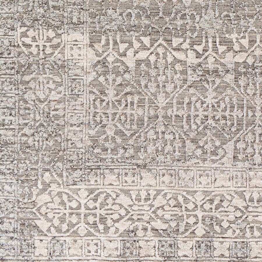 The Tunus Silver Rug features a globally inspired design made from wool. The hand-knotted rug adds wabi sabi charm to any room. Amethyst Home provides interior design, new home construction design consulting, vintage area rugs, and lighting in the Omaha metro area.