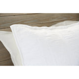 Crafted in Portugal, the Nantucket White Matelasse by Pom Pom at Home is a modern take on the matelasse with its beautiful interwoven weave. We love the soft, puckered appearance this brings to a bedroom.  Details & Care: 100% cotton. Machine wash cold; tumble dry low; warm iron as needed. Do not bleach